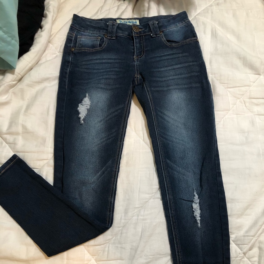 Distressed blue jeans